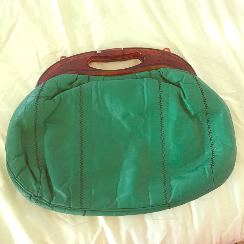 Green leather vintage clutch bag with handle
